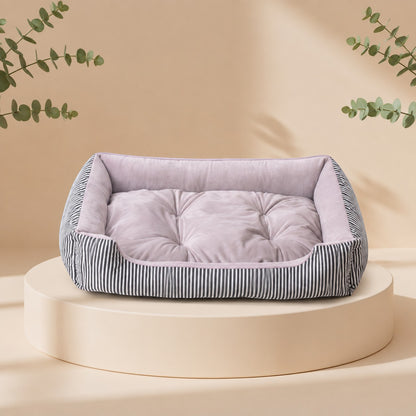 Cama para mascotas DELONEA SnoozePup de tela suave con interior acolchado color malva y exterior a rayas